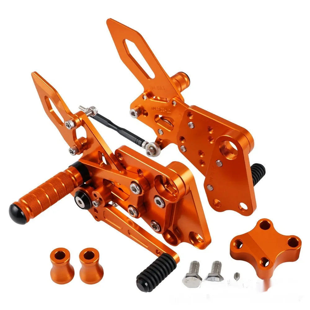 KTM Duke motorcycle rear shift pedal support assembly kit in black and orange.