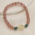 Women's strawberry quartz bracelet with blue water emerald pendant and peace buckle clasp