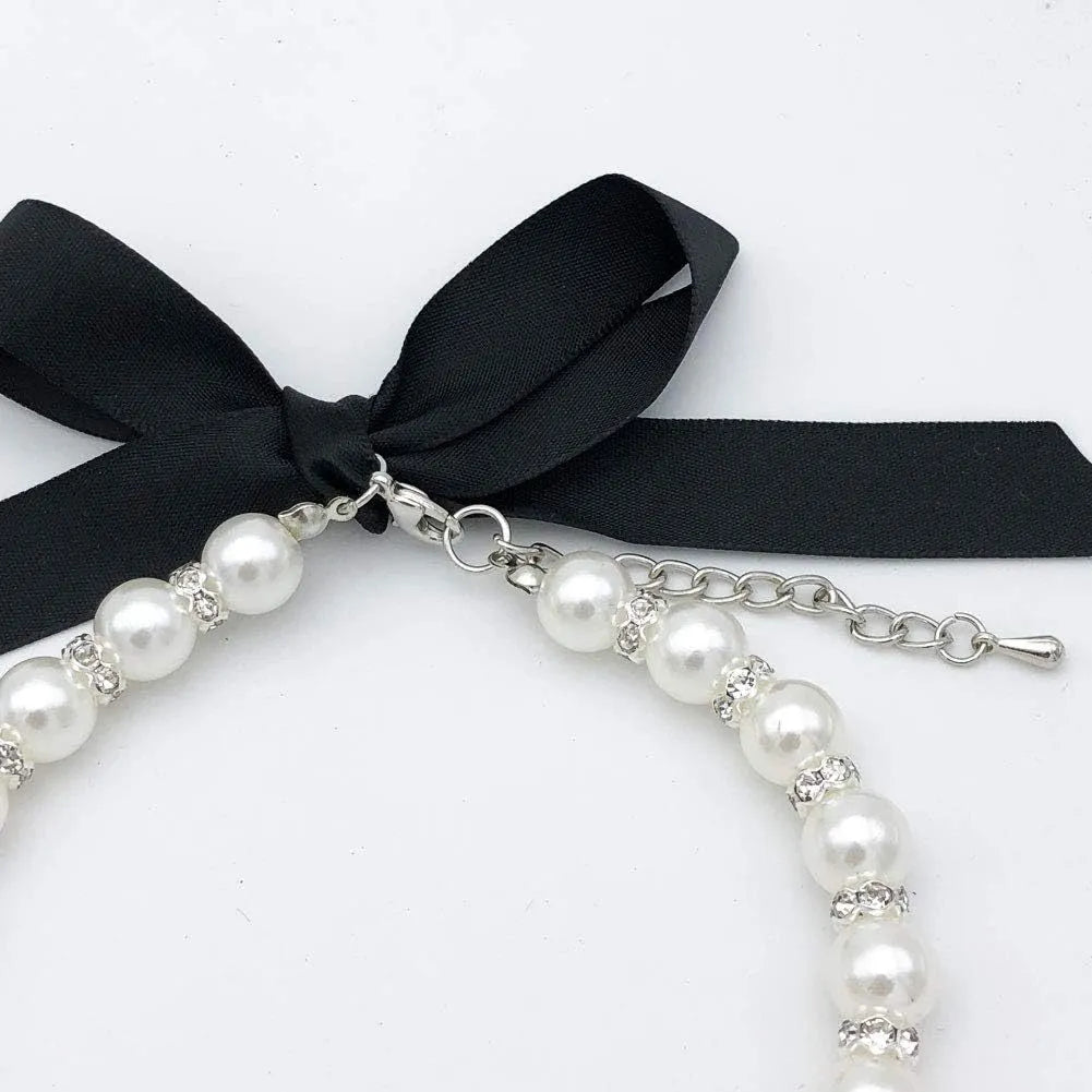 Diamond dog pearls necklace with adjustable clasp, imitation pearls, and rhinestones on soft ribbon for small pets
