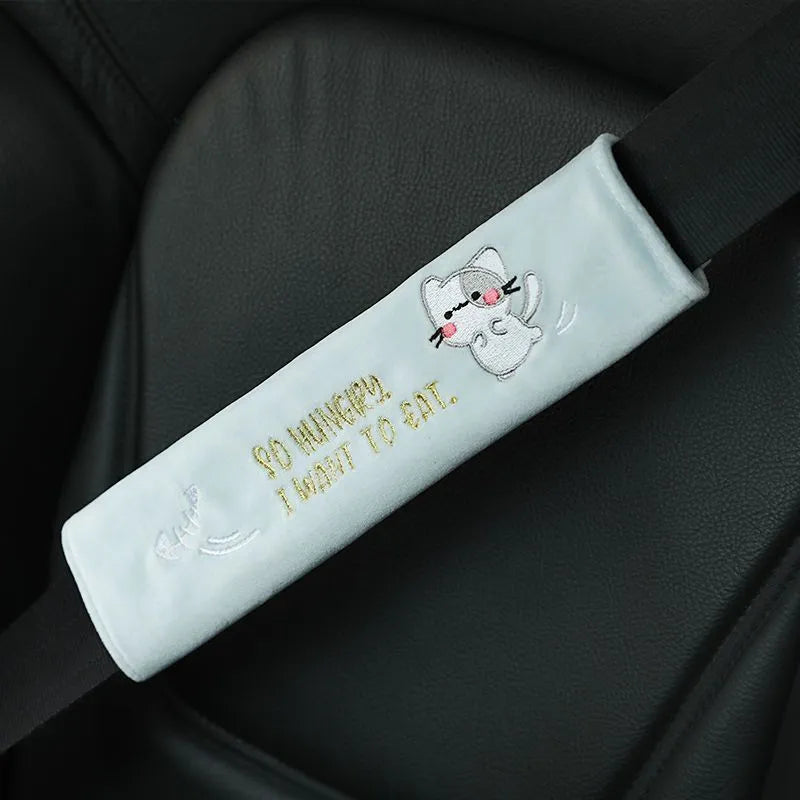 Plush embroidered car headrest shoulder pad in blue, green, black or pink with cartoon lion, dinosaur, kitten, puppy or rabbit motif