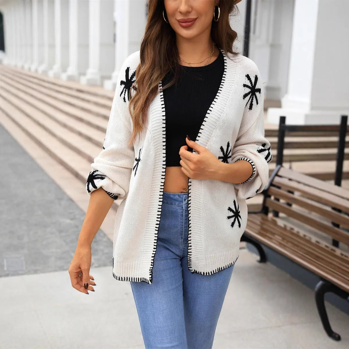 Women's jacquard knitted coat with floral pattern in beige and orange colours, loose fit cardigan design