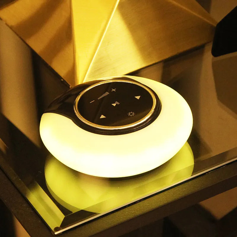 Bluetooth desk lamp speaker with folding design, touch controls, and dimensions of 148 x 148 x 48mm