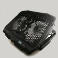 Black laptop cooling stand with copper heat sink, four heat pipes and dual USB ports