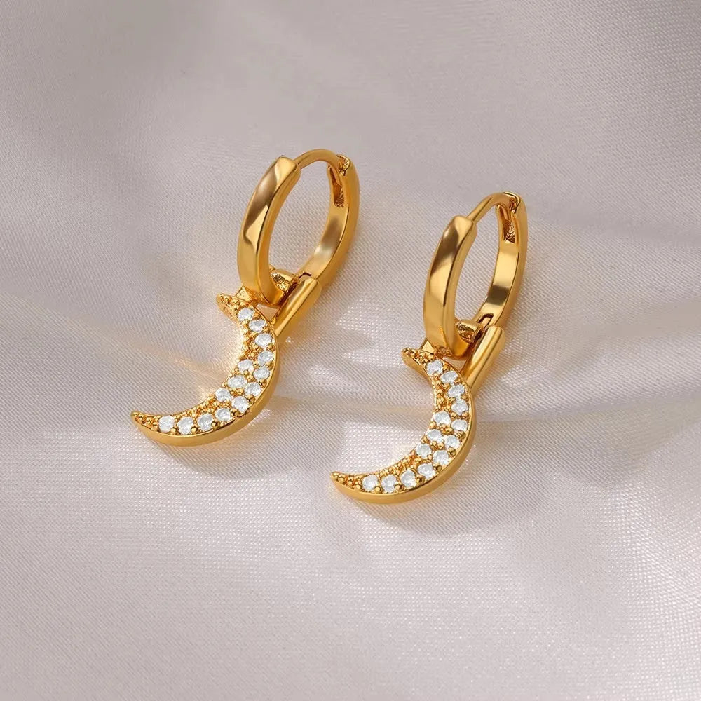 Women's irregular geometric butterfly earrings in copper with diamond treatment, showing heart-shaped and star design elements