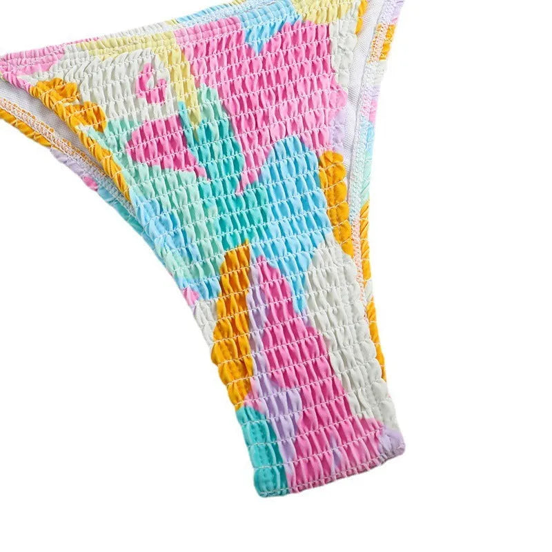 Women's multicolour floral triangle bikini with smocking detail on the top and briefs bottom.