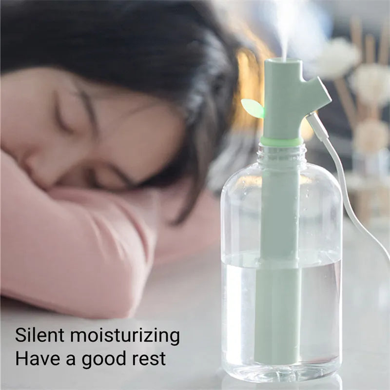 Transparent branch-shaped USB humidifier producing cool mist with 197mm height and 58mm diameter dimensions