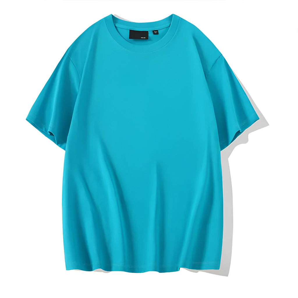 Solid colour loose fit cotton t-shirt with round neck and drop shoulder sleeves on a hanger