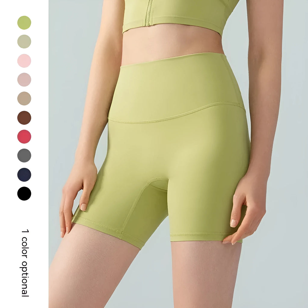 Women's high-waisted lycra yoga shorts in leaf green for fitness.