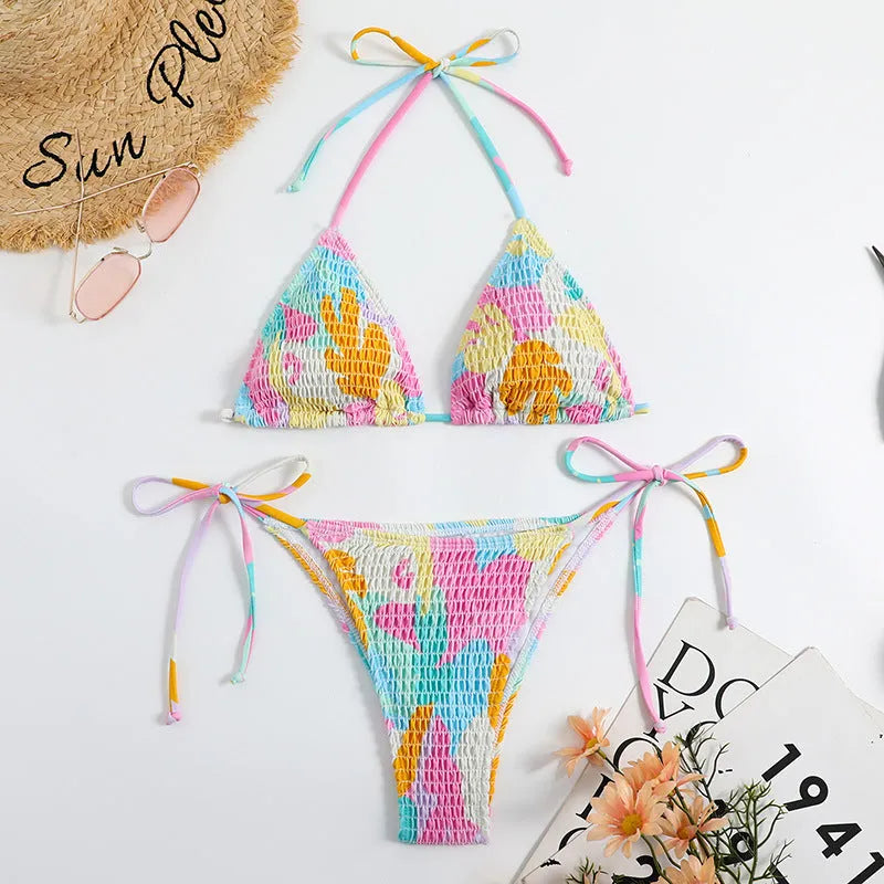 Women's multicolour floral triangle bikini with smocking detail on the top and briefs bottom.