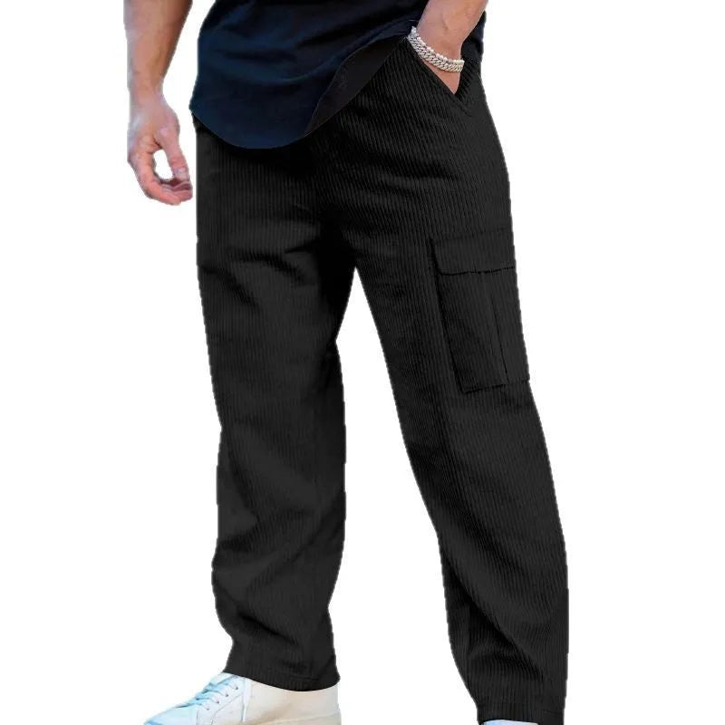 Men's straight-leg corduroy trousers in navy blue with drawstring waist, showing texture detail and relaxed fit