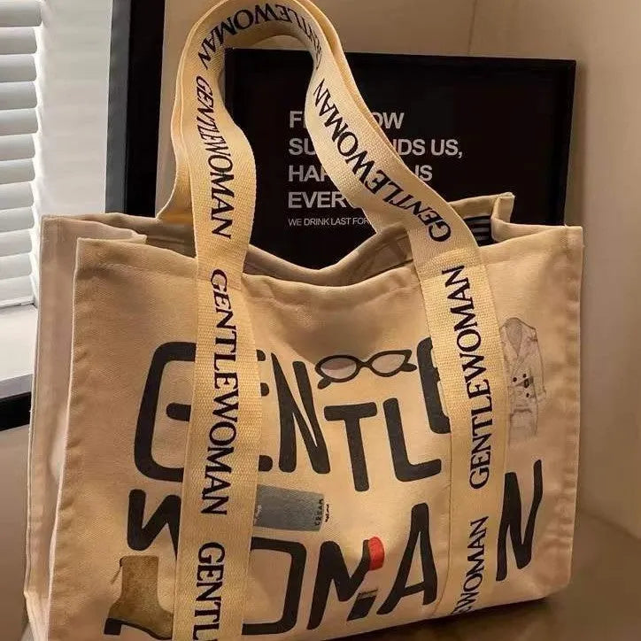 Canvas women's tote bag with printed design showing 45cm width and shoulder strap