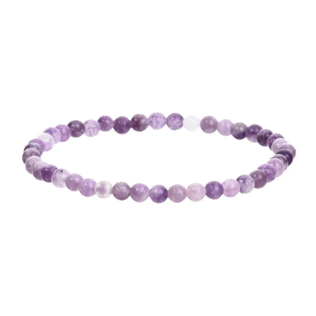 Purple natural stone elastic bead bracelet with geometric beads on a black background.