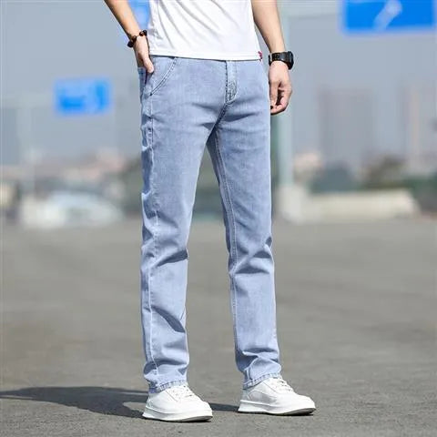 Men's straight leg jeans in smoky gray with low waist and zipper fly closure