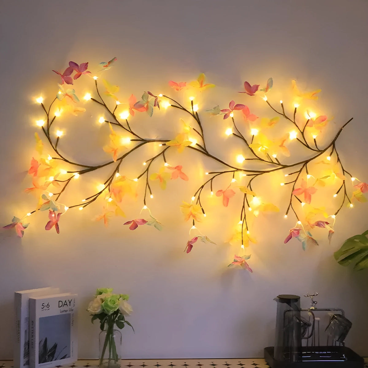1.8 metre tall flexible rattan tree lamp with colourful LED butterflies, showing bent branches.