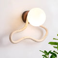 Middle Ancient style wall lamp with white travertine glass shade and solid wood base.
