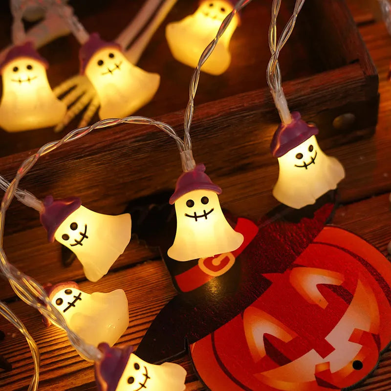 Halloween LED string lights with pumpkin, ghost and bat shaped covers, battery operated, PVC shell, warm white.