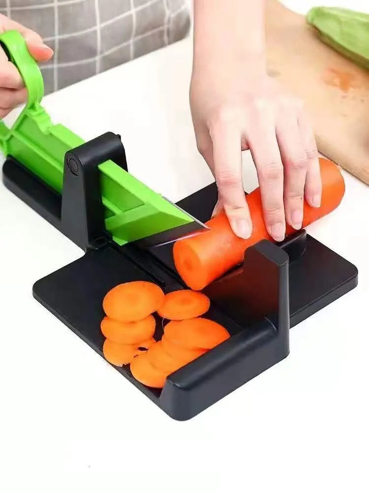 Green vegetable cutter with stainless steel blades for slicing carrots and potatoes