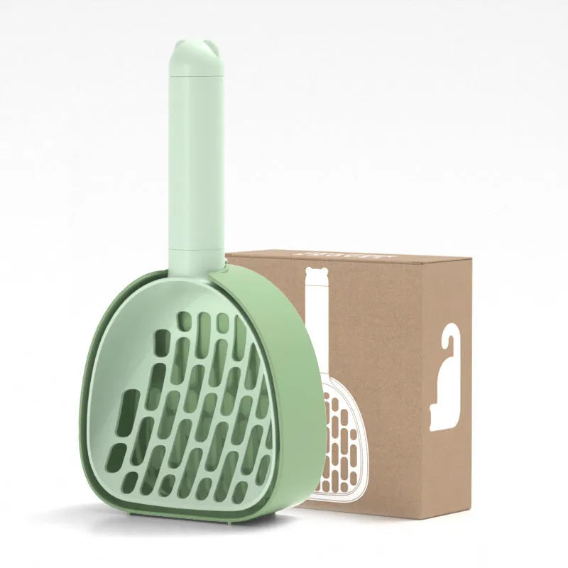 White ABS plastic cat litter scoop standing on a matching storage base with integrated waste bag roll.
