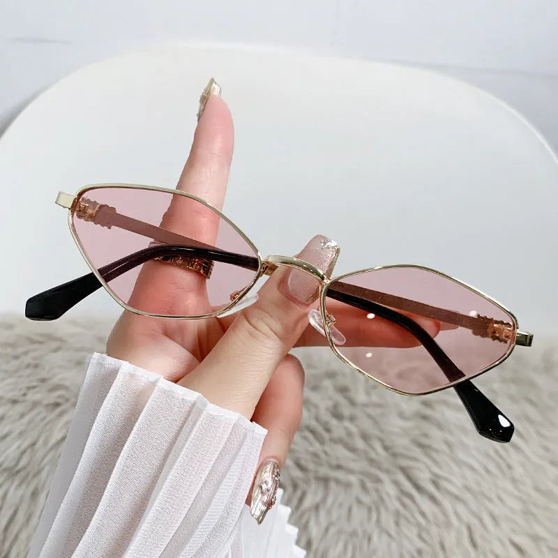 Small cat eye sunglasses with metal frame and rhombus temple design in gold with grey lenses