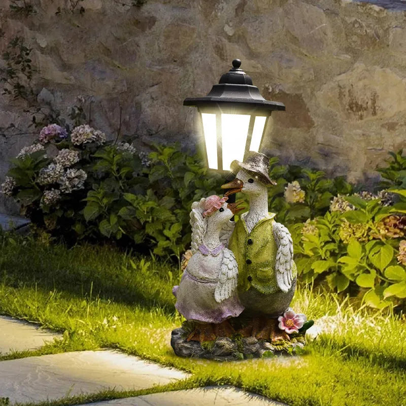 Hexagonal solar garden lamp with resin animal figure, 30cm tall with 24 LED lights for outdoor illumination