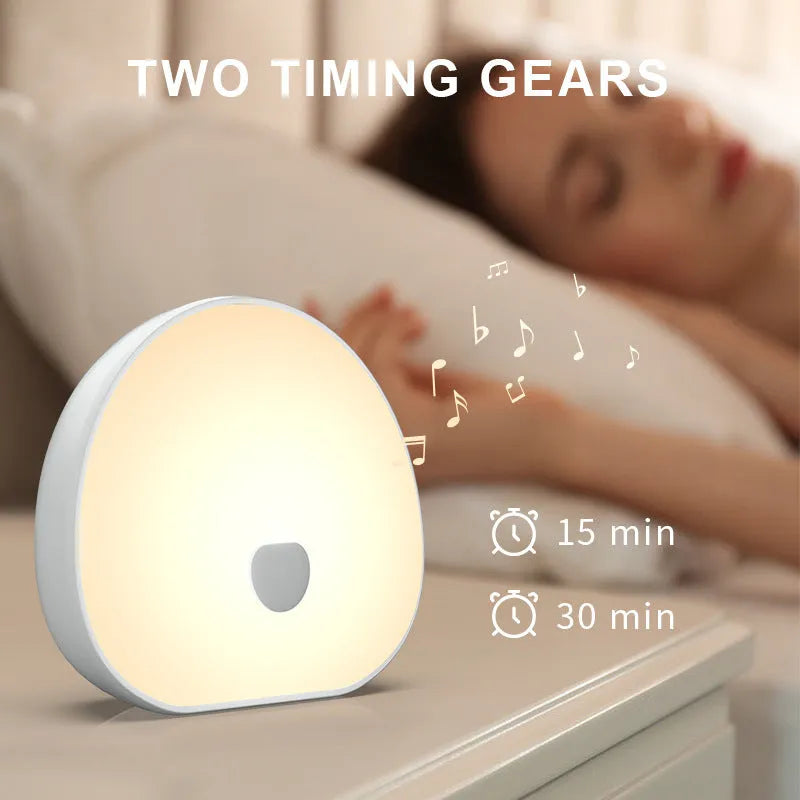White rechargeable baby night feeding comforter with music function on display