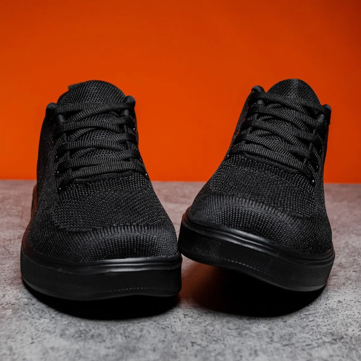 Flat heel casual board shoes with mesh upper and EVA sole in black or white colours