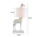 White or gold giraffe table lamp 66cm tall with fabric shade