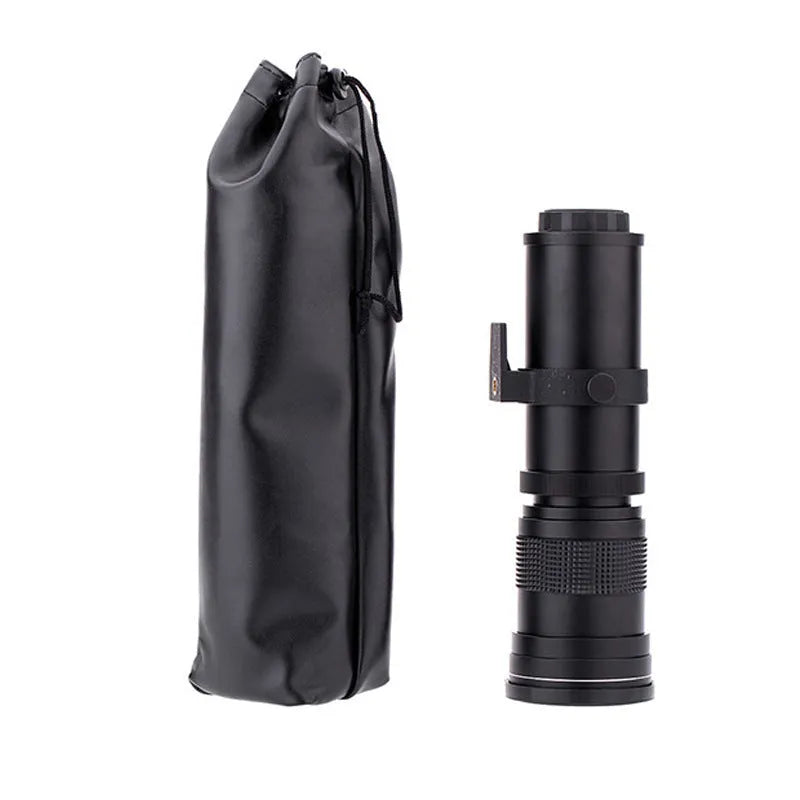 Black manual telephoto zoom camera lens with 420-800mm focal length shown next to its T-mount adapter ring.