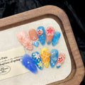 Plastic wearable armour set with three-dimensional carved jellyfish designs and rose patterns in almond nail colour