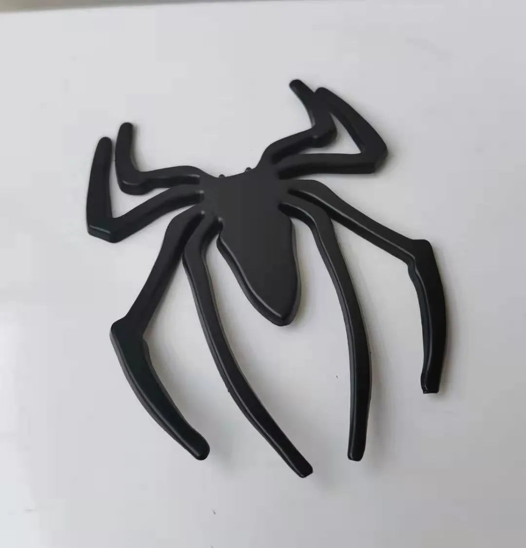 Three-dimensional metal spider bumper sticker showing raised design on zinc alloy with 7x5cm dimensions