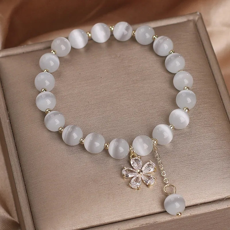 White cat's eye crystal women's bracelet with morganite safety buckle pendant and small flower tassel
