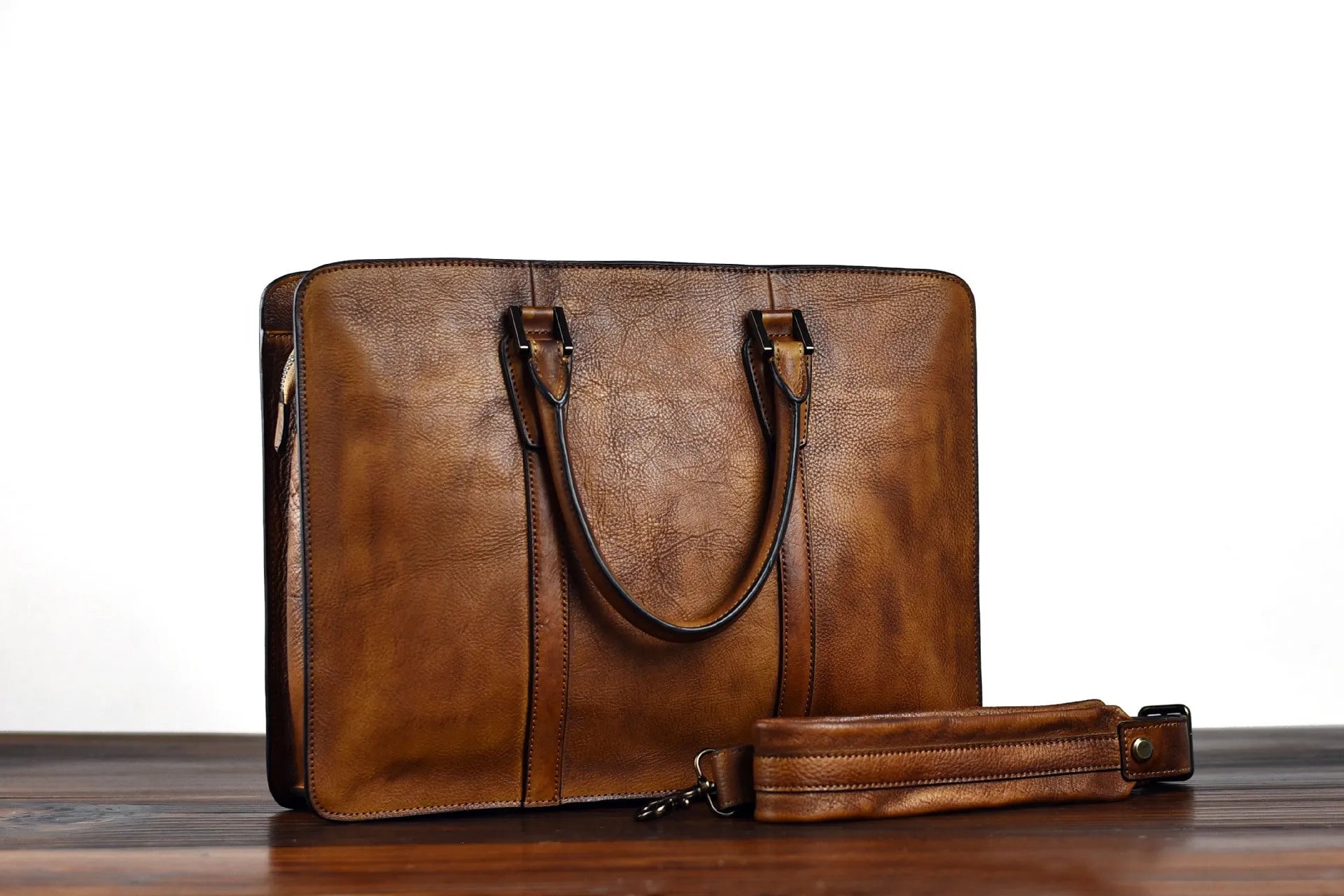 Men's 14-inch horizontal leather handbag with zipper opening in khaki colour, showing vegetable-tanned cowhide texture