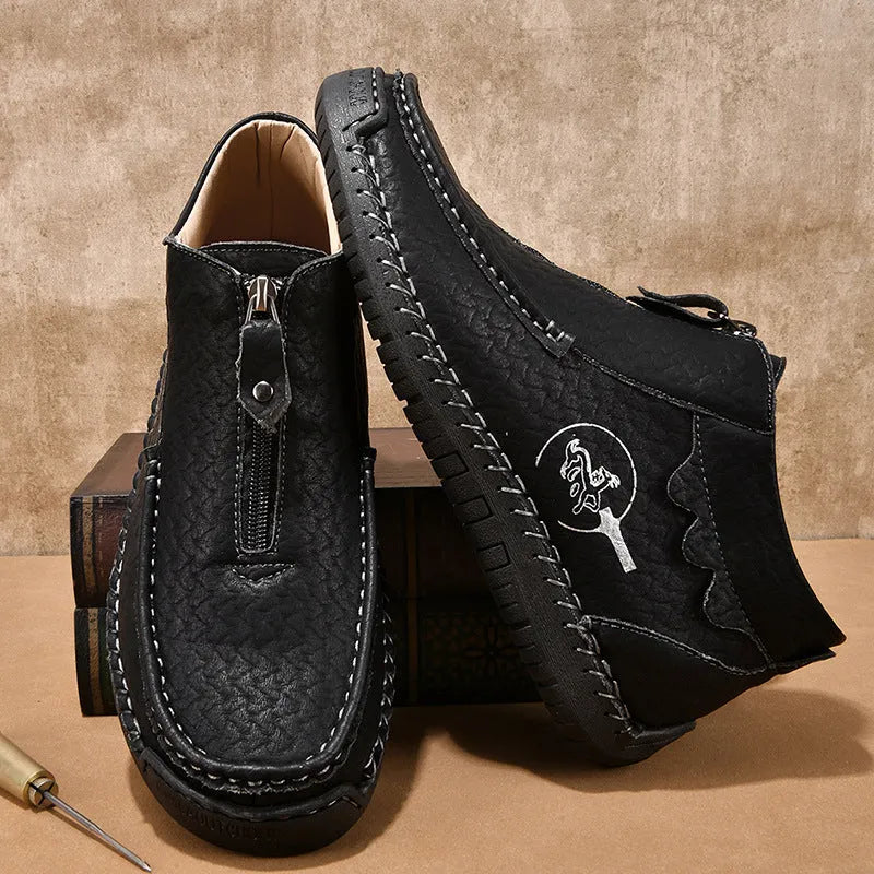 Men's slip-on loafers in black with round toe, low heel, and sewing thread details on PU upper
