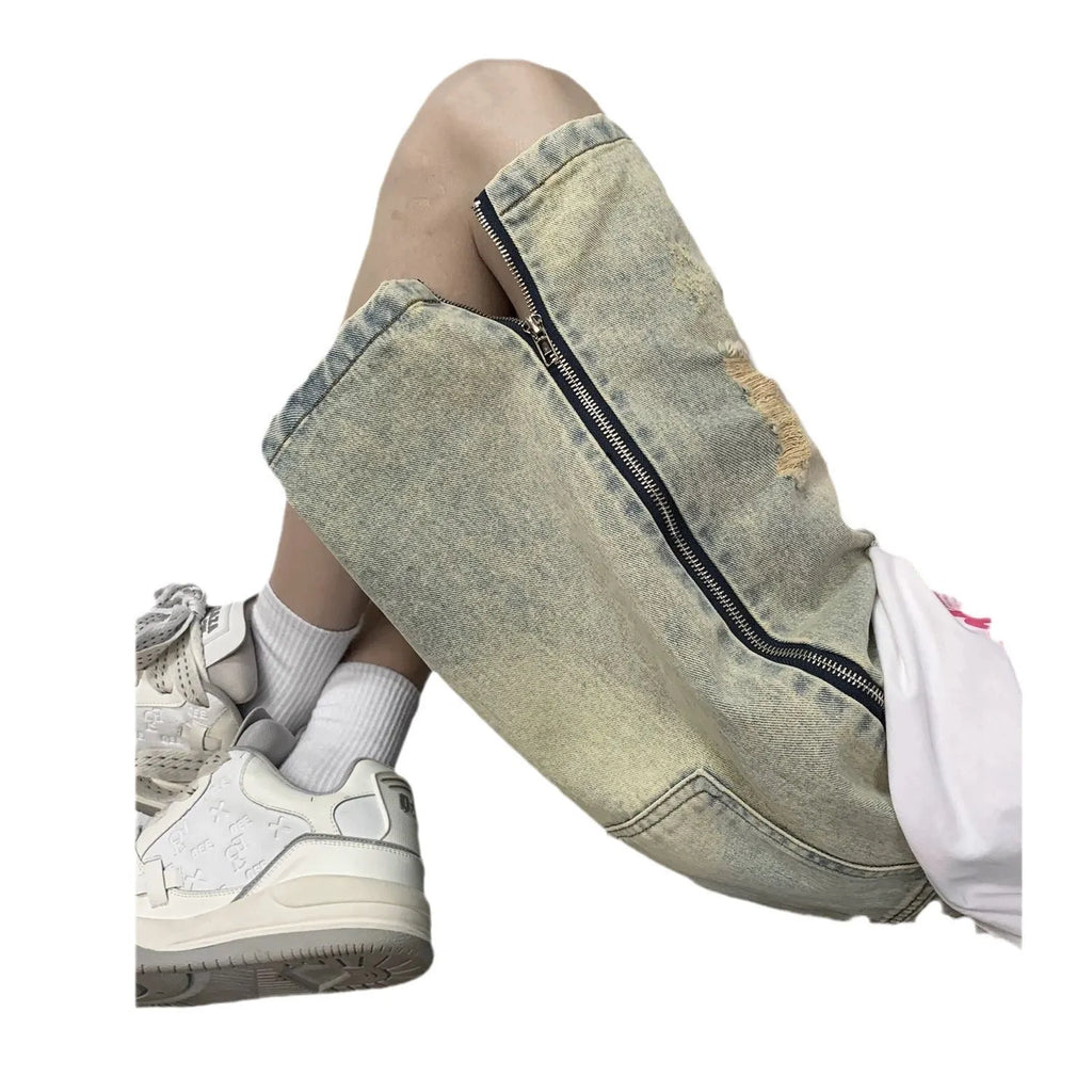 Retro blue men's ripped denim shorts with a loose fit and straight leg opening on a cardigan.