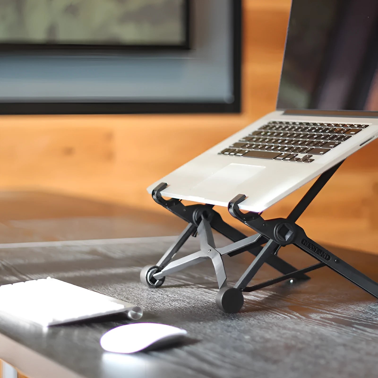 Black foldable portable laptop stand with enhanced nylon construction shown folded to 35.4cm with carrying case