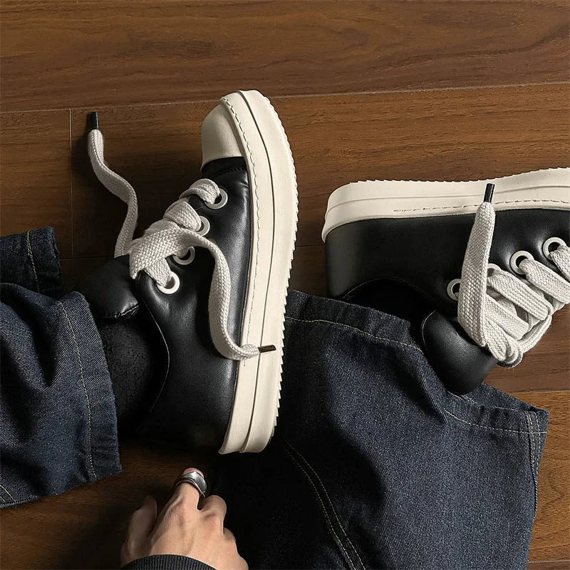 Men's black leather slip-on shoes with flat sole and front lace-up