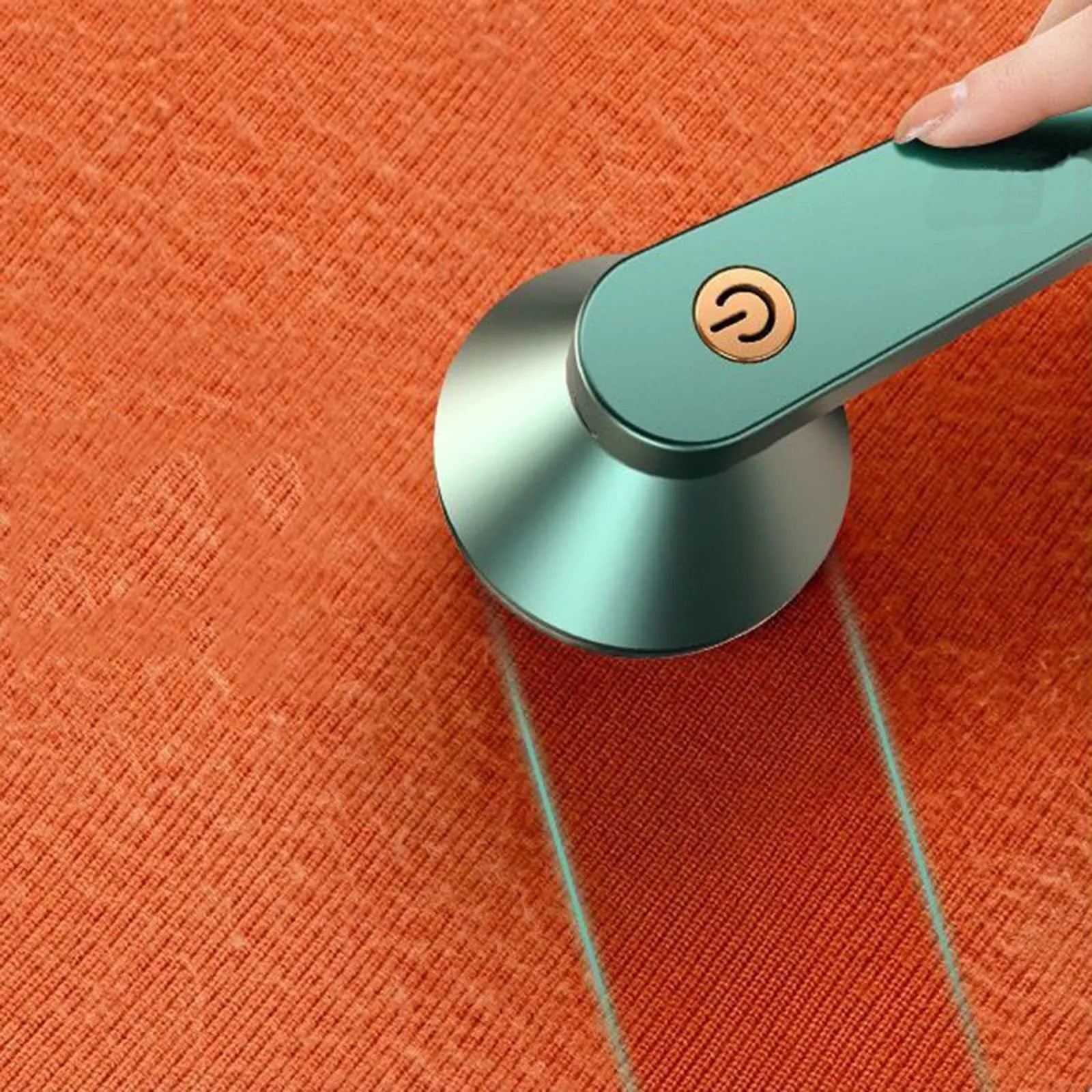 White USB rechargeable electric lint remover shaver with removable lint collector container on a sweater.