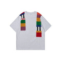 Cotton pullover with patchwork design showing letter patterns in loose fitting short sleeve style