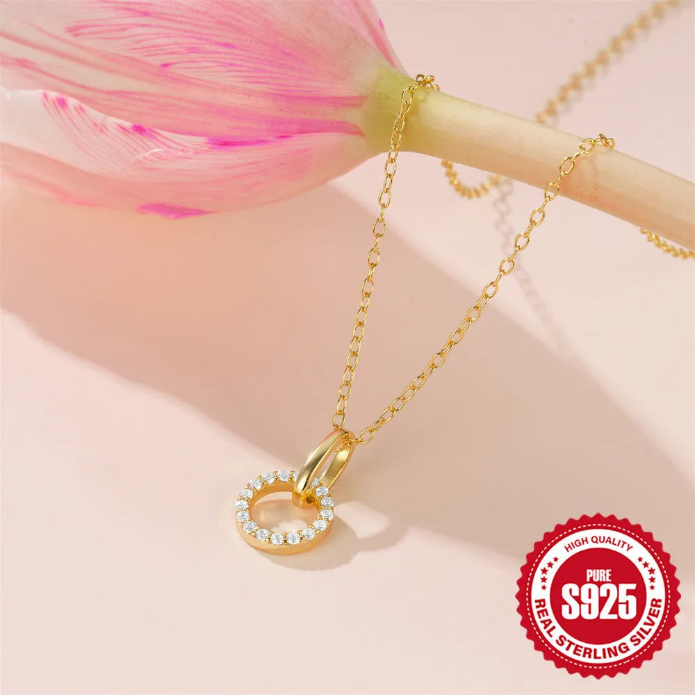 Gold colour geometric interlocking zircon pendant on an adjustable S925 sterling silver clavicle chain.