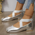 Gold slip-on evening pump with square toe and low rubber heel on a white background