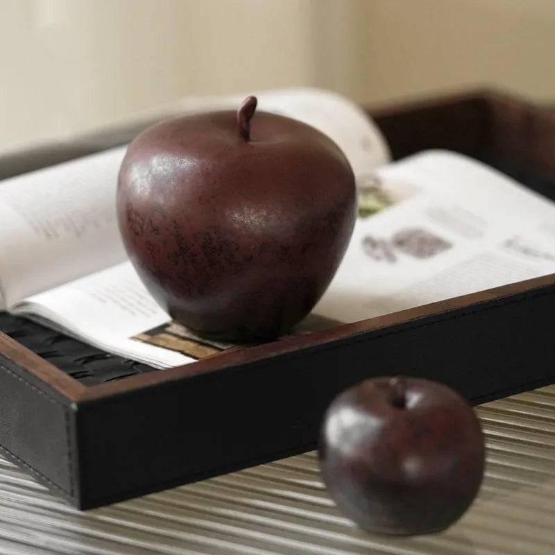 Retro Chinese ceramic simulation apple ornament on desktop, showing authentic details and ceramic construction