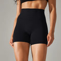 Women's high waist hip lift fitness tights in dark green, shown for sports and casual wear.