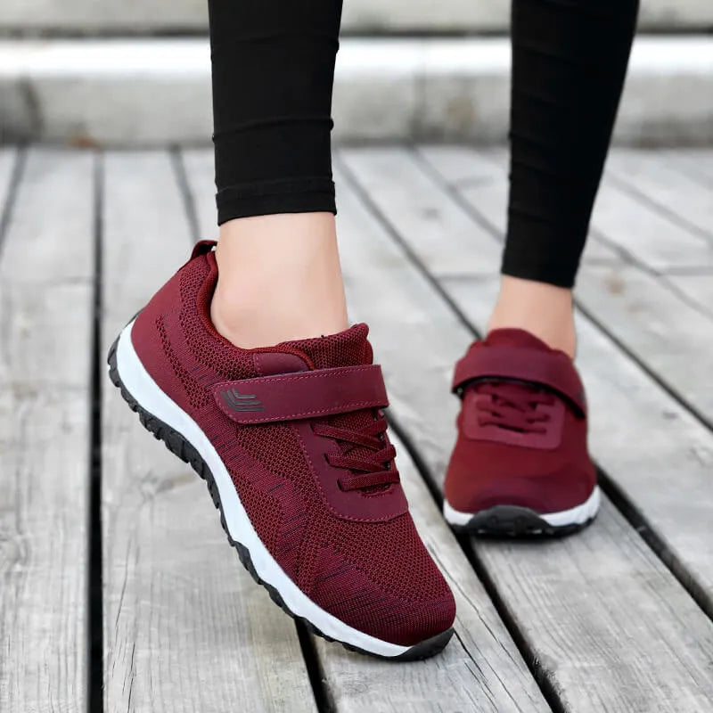 Women's low-top wedge shoes with Velcro strap and mesh upper in a solid colour