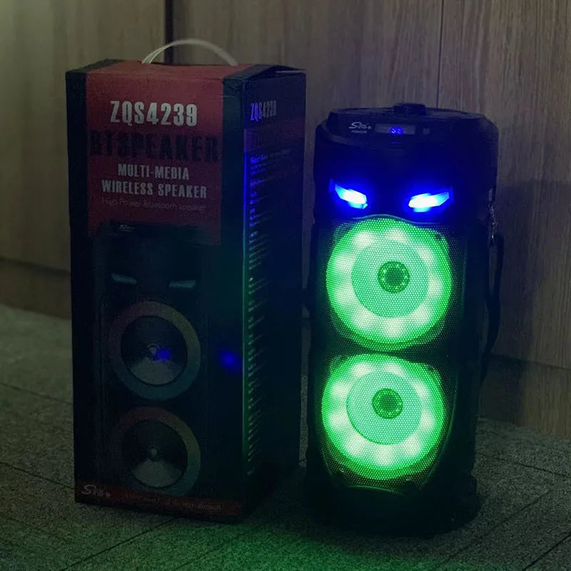 Black portable Bluetooth speaker with dual horn design and wheat-themed accents
