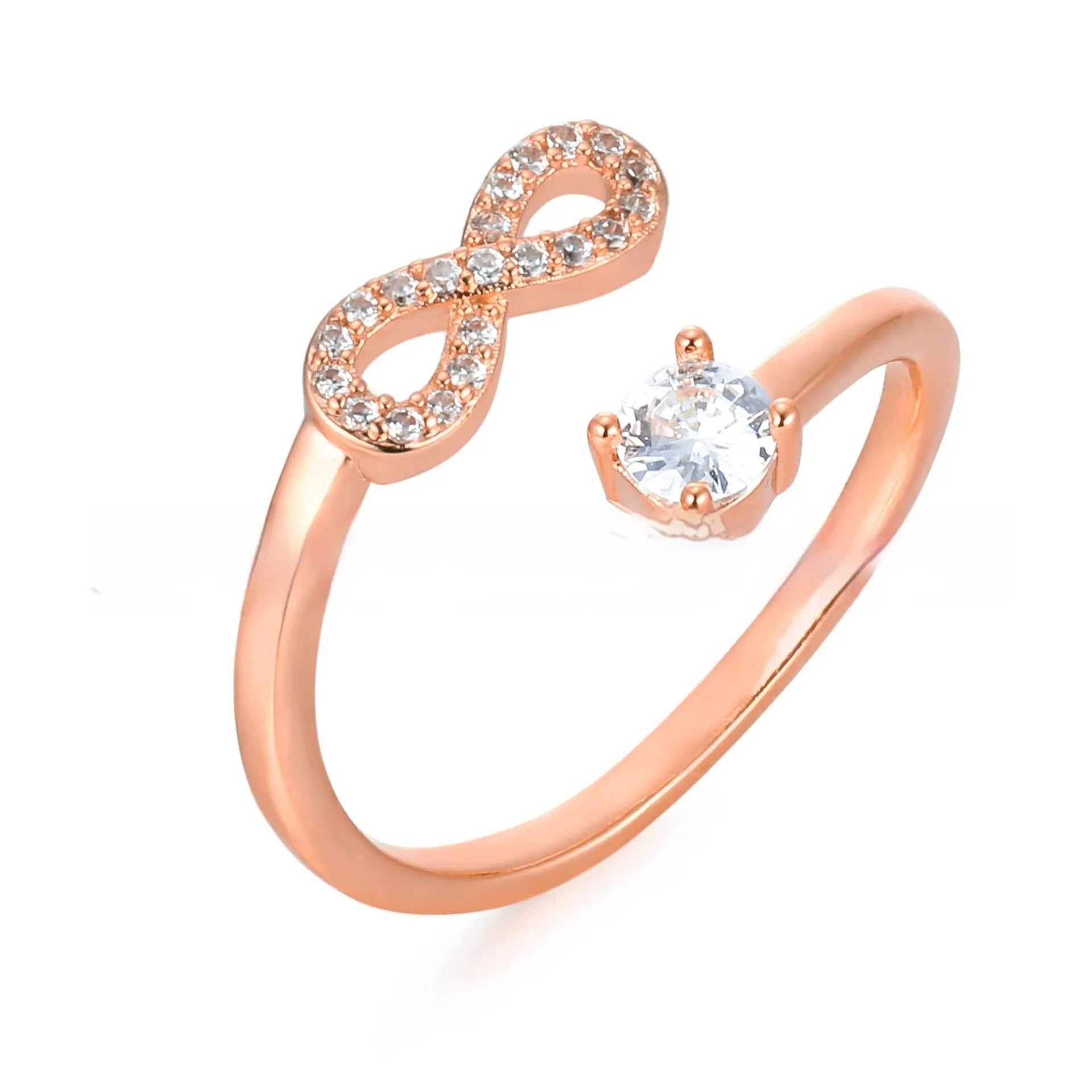 Geometric open zircon ring showing letter personalisation option with inlaid stones and metal construction