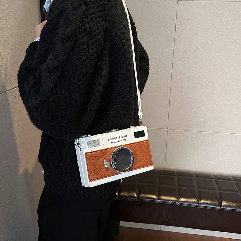 Soft PU leather mini crossbody camera bag in a horizontal square shape.