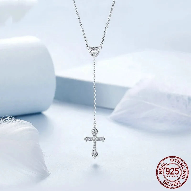 Silver cross necklace on O-ring chain with V-neck pendant design