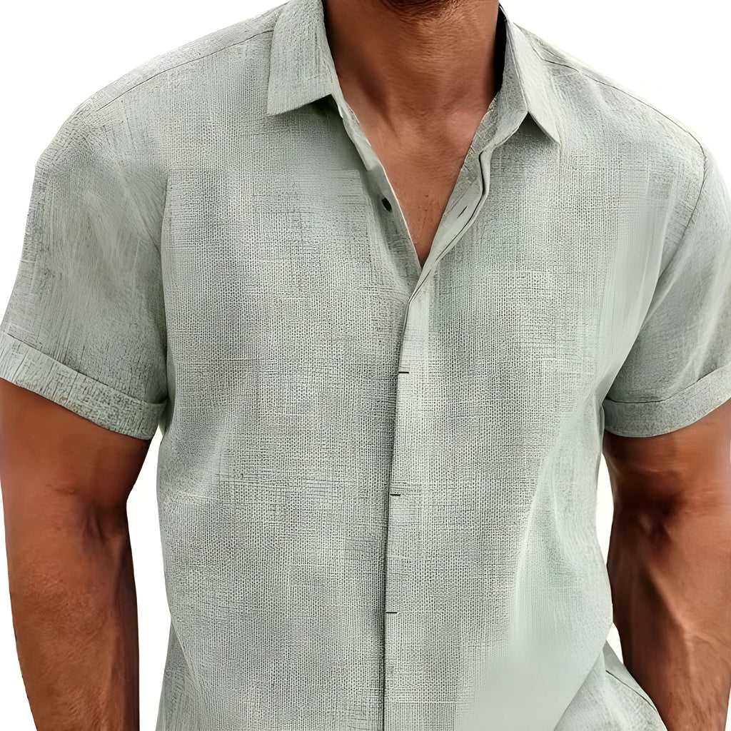 Men's matcha colour loose fitting short sleeved cardigan style top with standing collar and double placket.