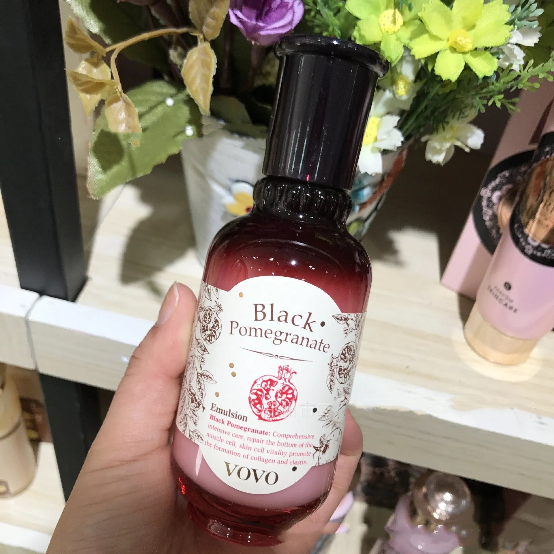 Pomegranate skincare set showing six products: cleanser, water, milk, cream, essence, and eye cream.