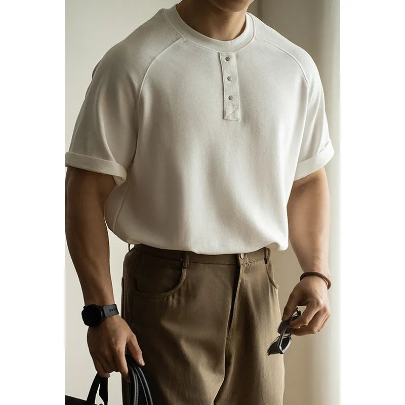 Casual pullover top with raglan sleeves in terry texture fabric showing loose fit and colour options